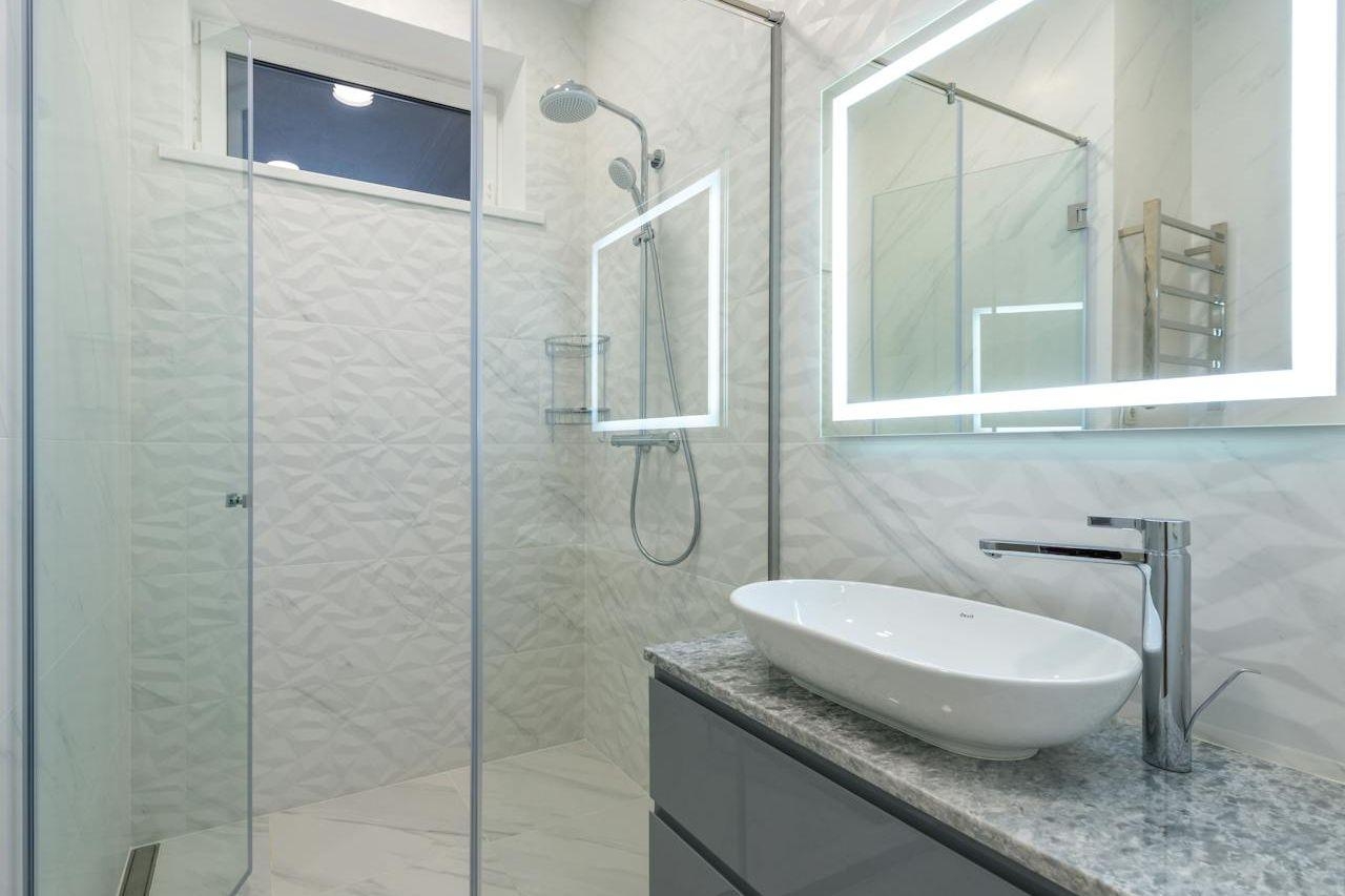 Modern bathroom with LED lighting around the mirror